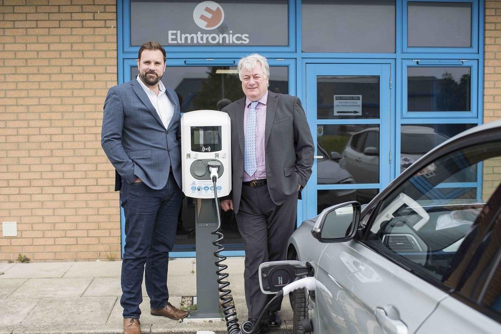Electric vehicle being charged in front of Elmtronics offices