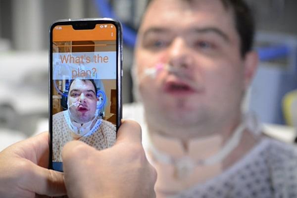 Liopa's app being used on a smartphone to read a male patient's lip movements