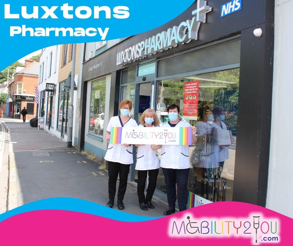 nurses in front of luxtons pharmacy